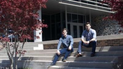 Duke students sit outside the Wilkinson Building 